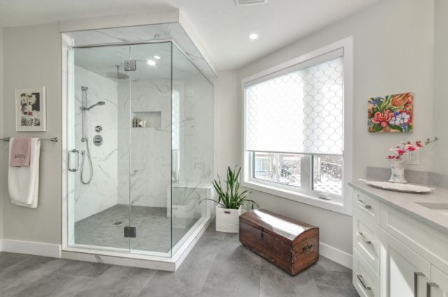 Large bathroom with big walk in shower and tile flooring