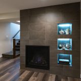 Is a Basement Renovation Worth It Featured image of a finished basement with fireplace