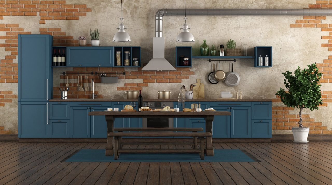 A kitchen with navy blue cabinets