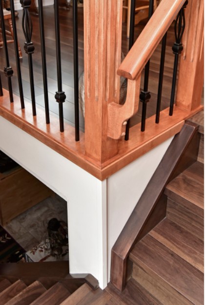Renovated staircase with dark wood flooring covering all parts of the staircase